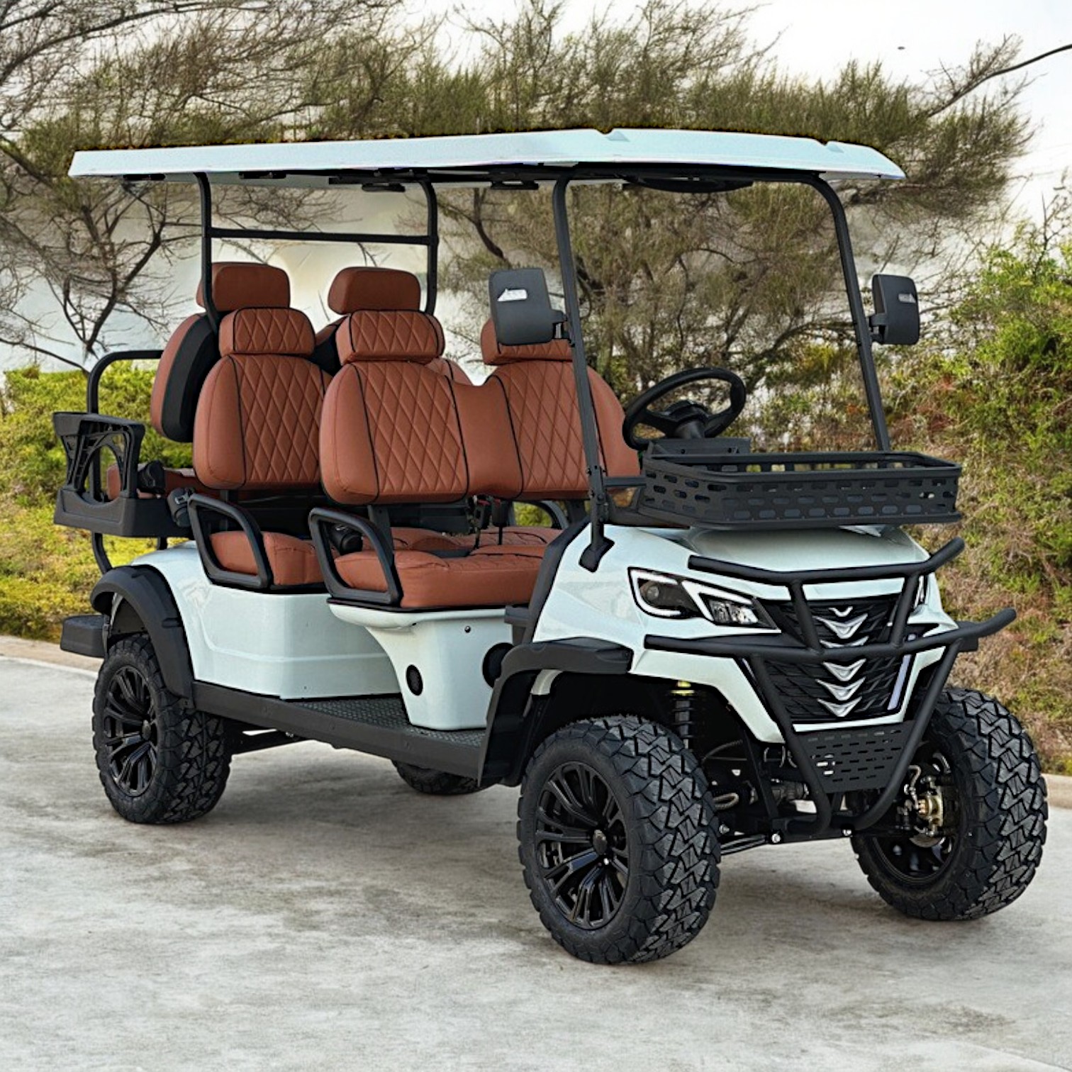 Luxury golf cart with brown leather seats and white exterior